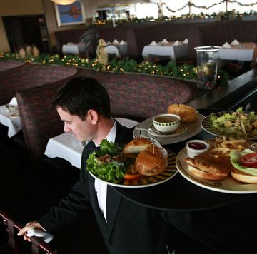 restaurants open on christmas waiter holding a tray of food