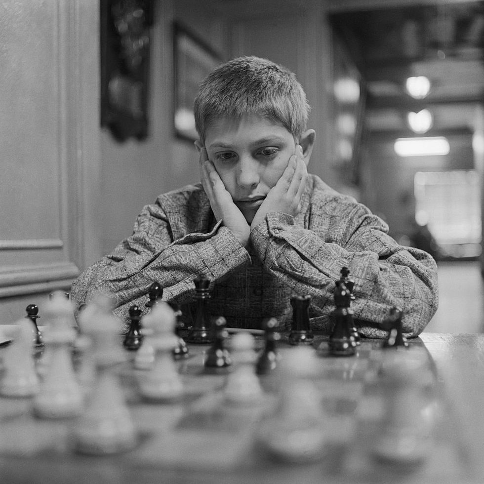 bobby fischer with hands on his face while concentrating
