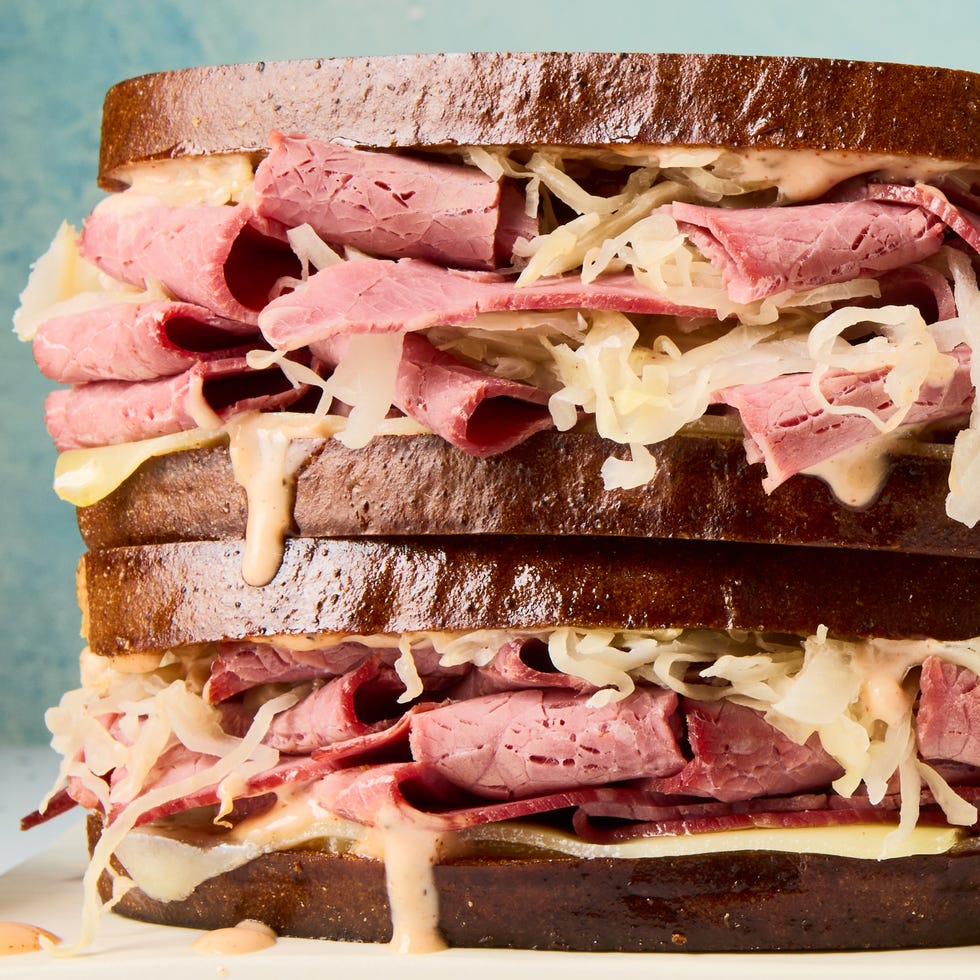 corned beef, swiss cheese, sauerkraut, and russian dressing between toasted rye bread