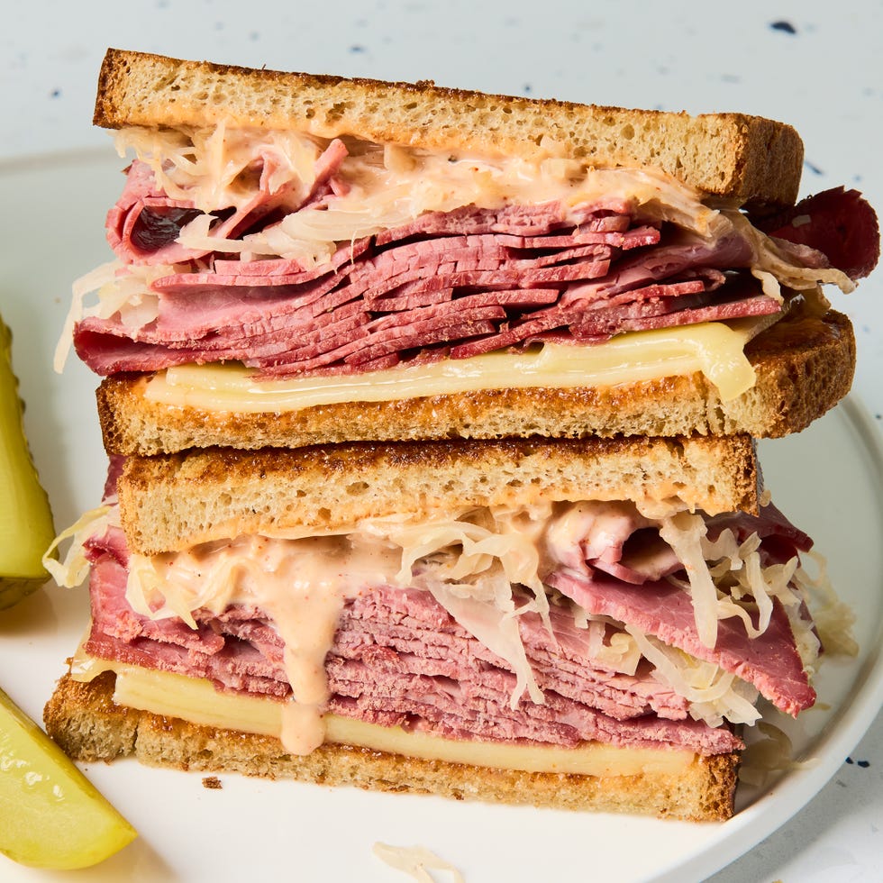 corned beef, swiss cheese, sauerkraut, and russian dressing between toasted rye bread