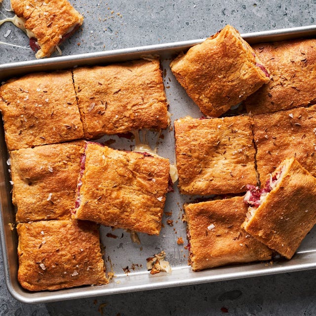 Reuben Squares corned beef, swiss cheese, sauerkraut, and russian dressing in crescent rolls