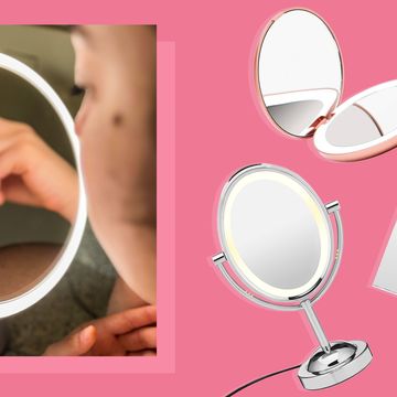 a person using a lighted vanity mirror