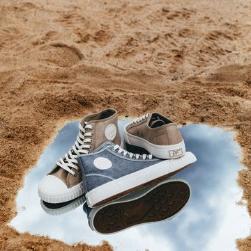 a pair of shoes on a dirt surface
