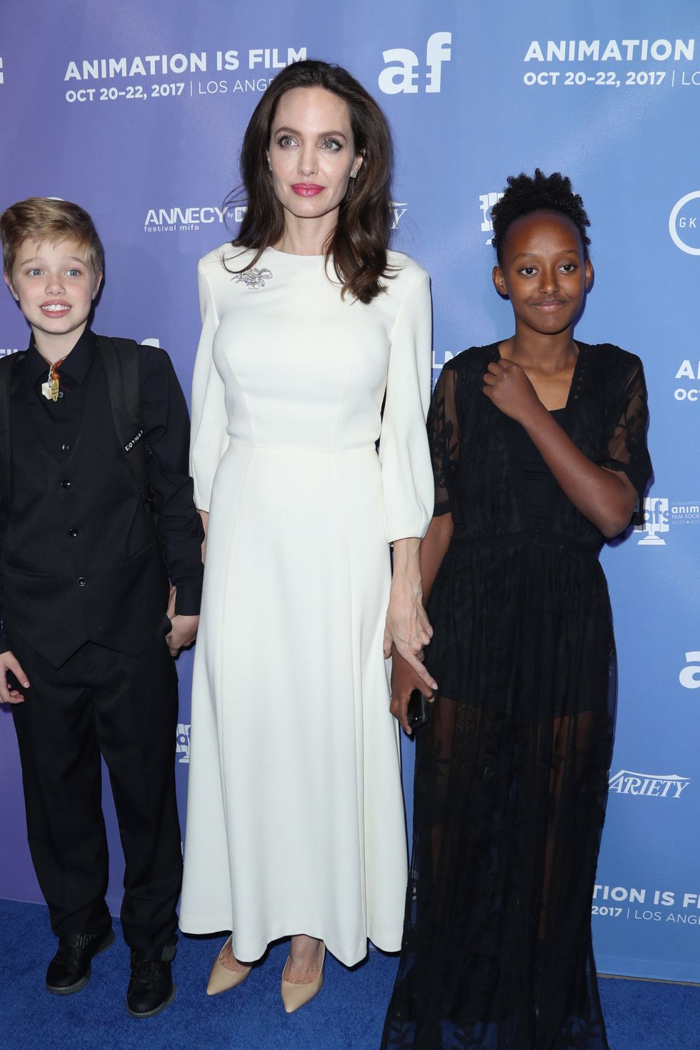 Angelina Jolie with her daughters on the red carpet