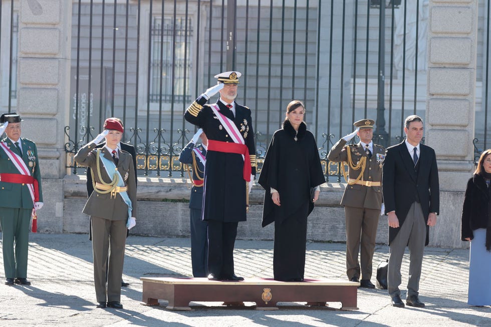 a group of people standing in front of a building