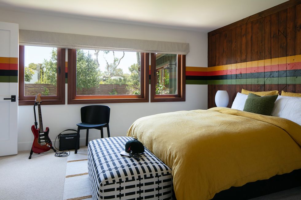 bedroom with wood paneling wall
