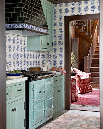 a small kitchen with a bed and a bunk bed