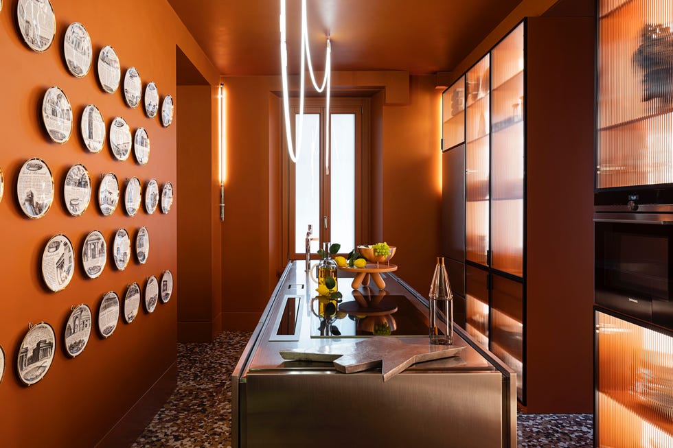 riccardo grassi home milan kitchen with fornasetti plates