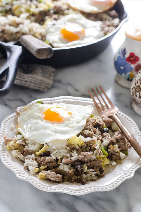 breakfast fried rice in white bowl with fried egg