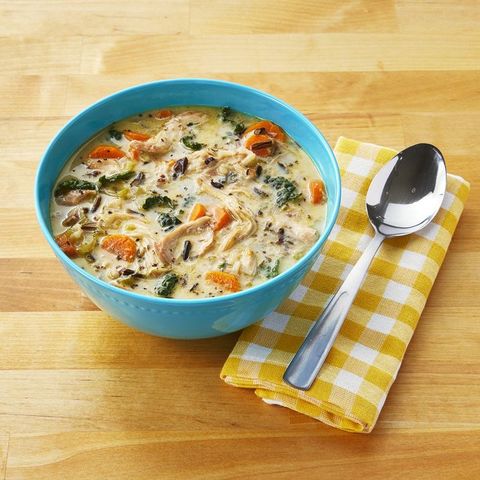 creamy chicken and wild rice soup in blue bowl