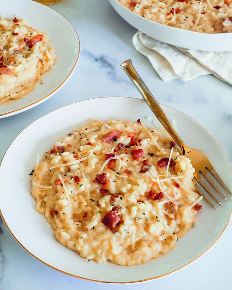 instant pot risotto a la carbonara  in white bowls with fork