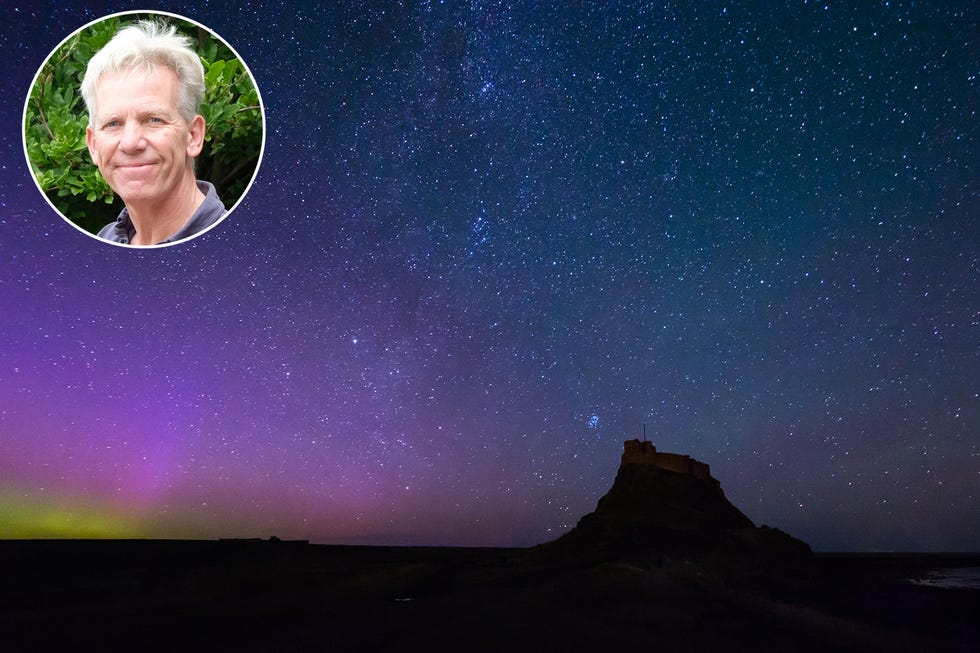 the aurora borealis and milky way above lindisfarne castle on holy island in northumberland
