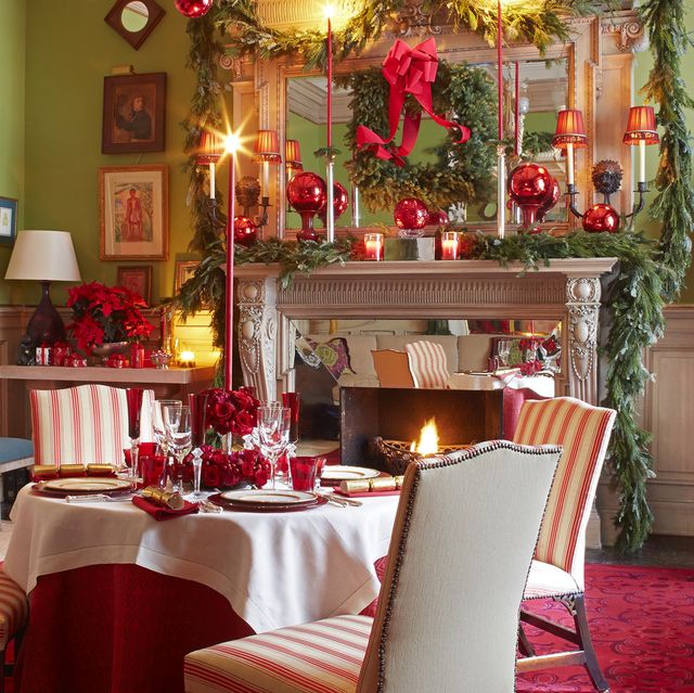 a living room turned dining room is set up for a fancy holiday party