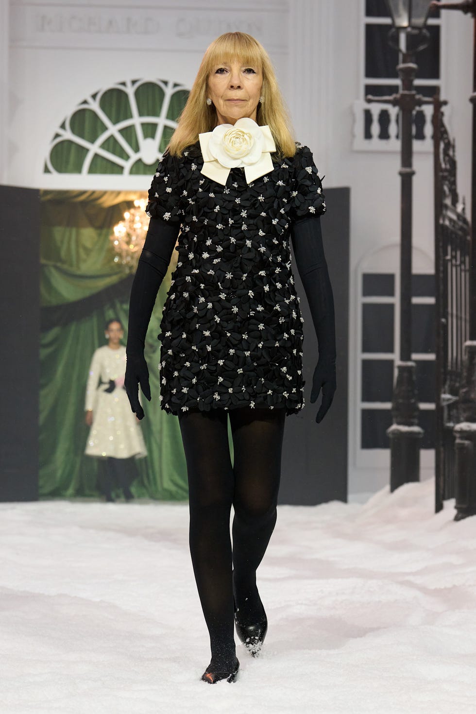 fashion model showcasing a black floral dress
