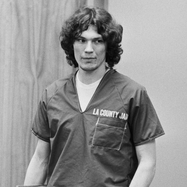 richard ramirez holding a binder while standing in a courtroom