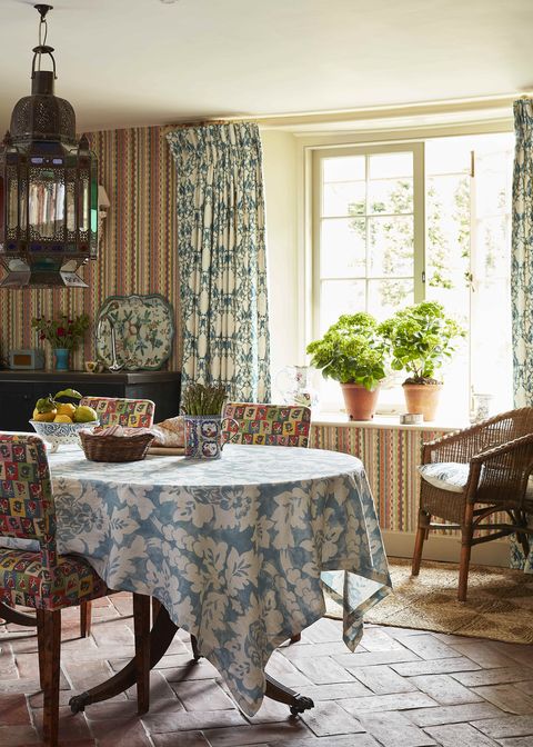 the french stripe patchwork on the walls pulls together the disparate elements of the kitchen, seems appropriate in both summer and winter, and makes a colourful background to frequent kitchen suppers for six or eight
