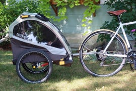 a bicycle with a trailer attached to it