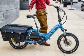 a person pushing a bicycle