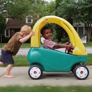 kids playing with cozy coupe ride on toy