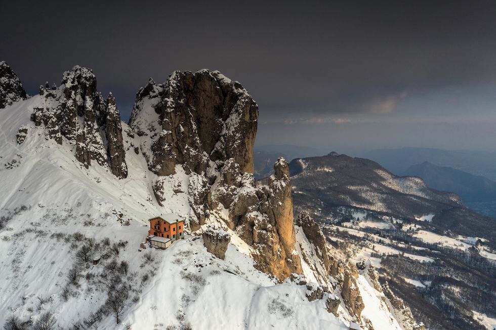 rifugio rosalba in winter at sunset after a snowfall.