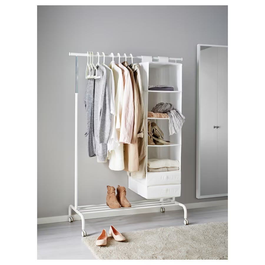 clothing rack with various garments and storage options