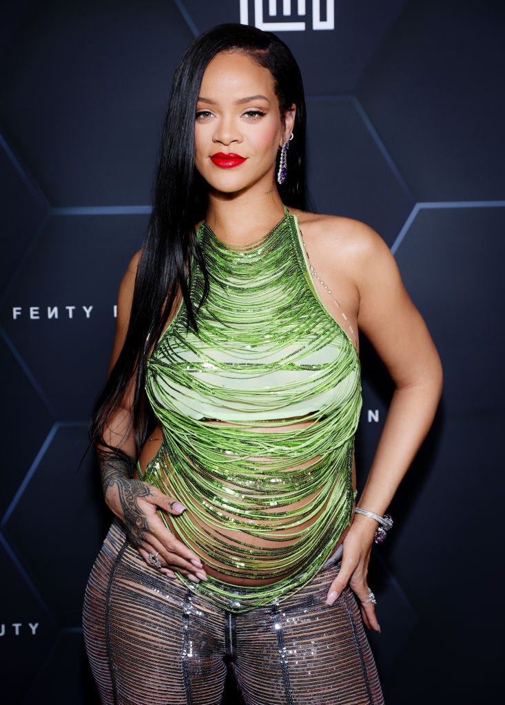 Rihanna looks glowing in a tiny golden mini dress