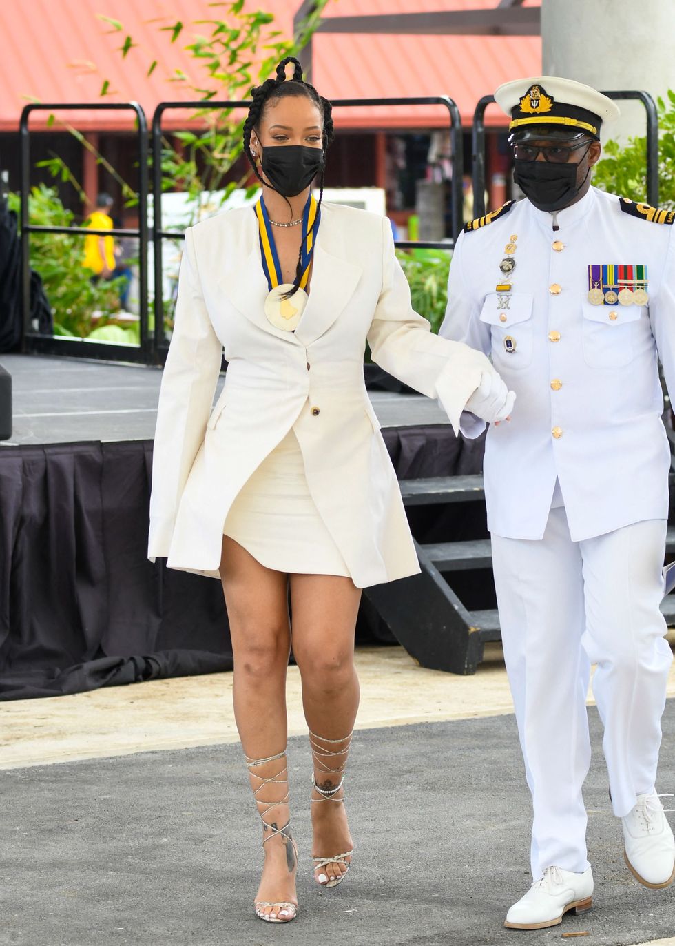 rihanna during the national honors ceremony in a white dress and blazer