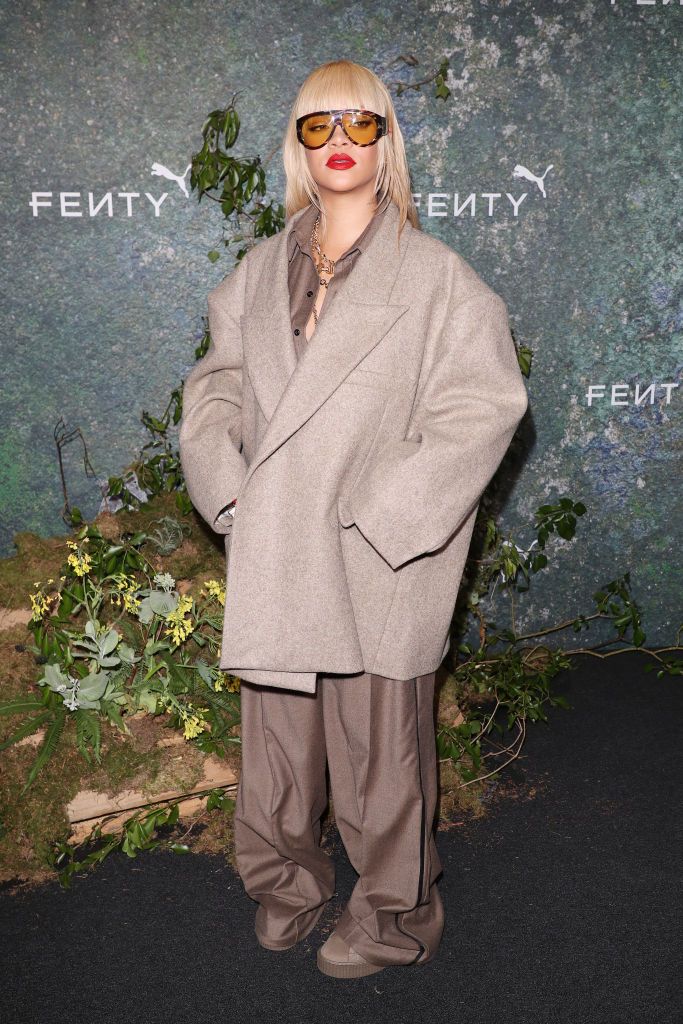rihanna at fenty x puma creeper phatty earth tone launch party dressed in an oversized light brown suit jacket and a brown suit and creeper shoes