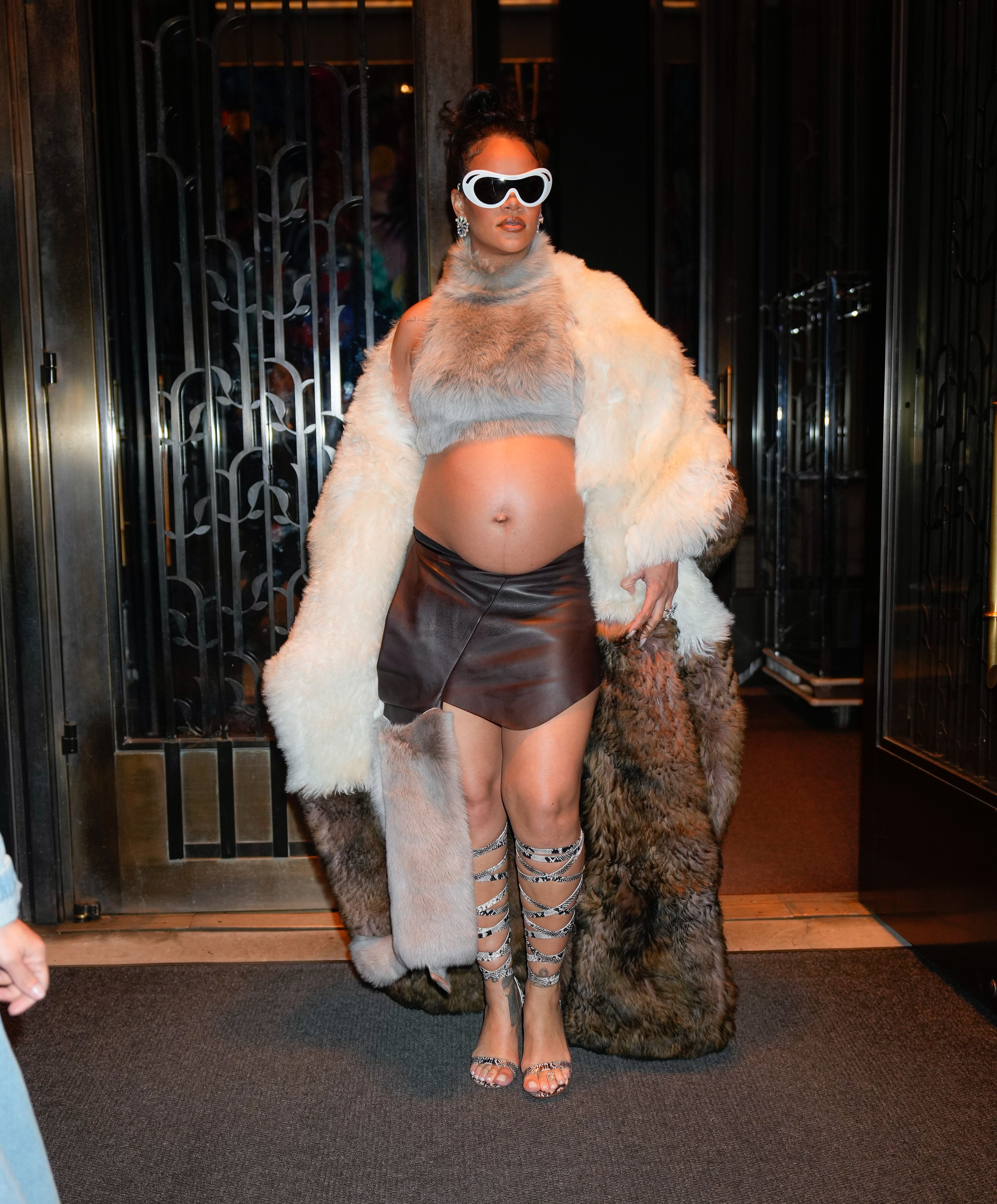 Rihanna Shows Off Baby Bump Under Luxurious Fur Coat