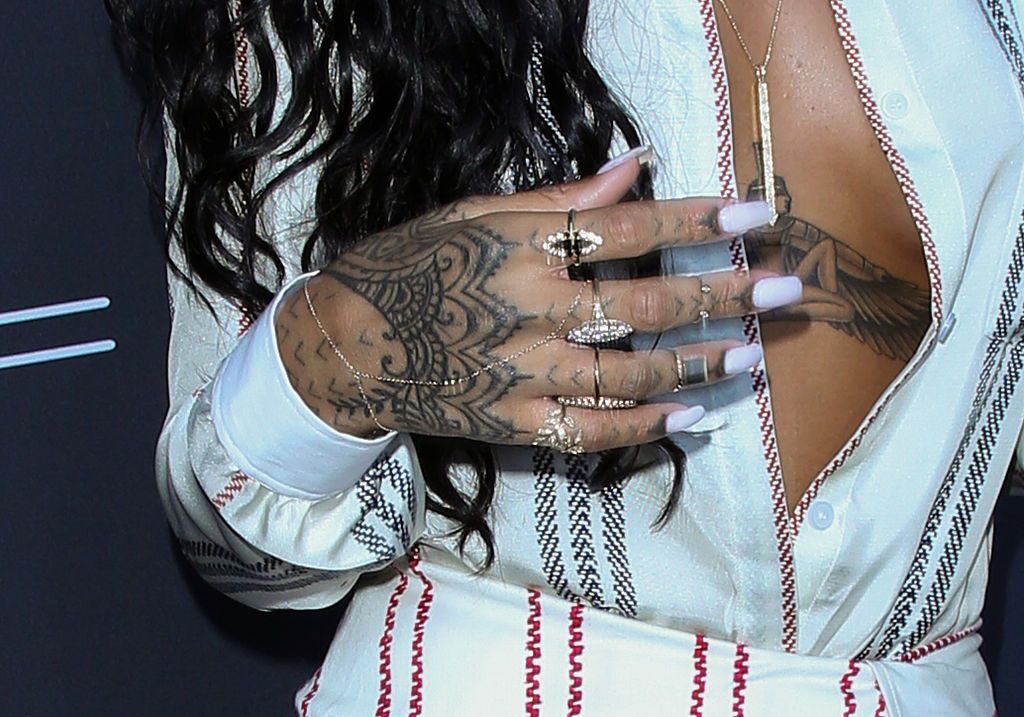 Rihanna shows off incredible chest tattoo at Oceans 8 premiere - now here's  what her 25 inkings all mean | The Irish Sun