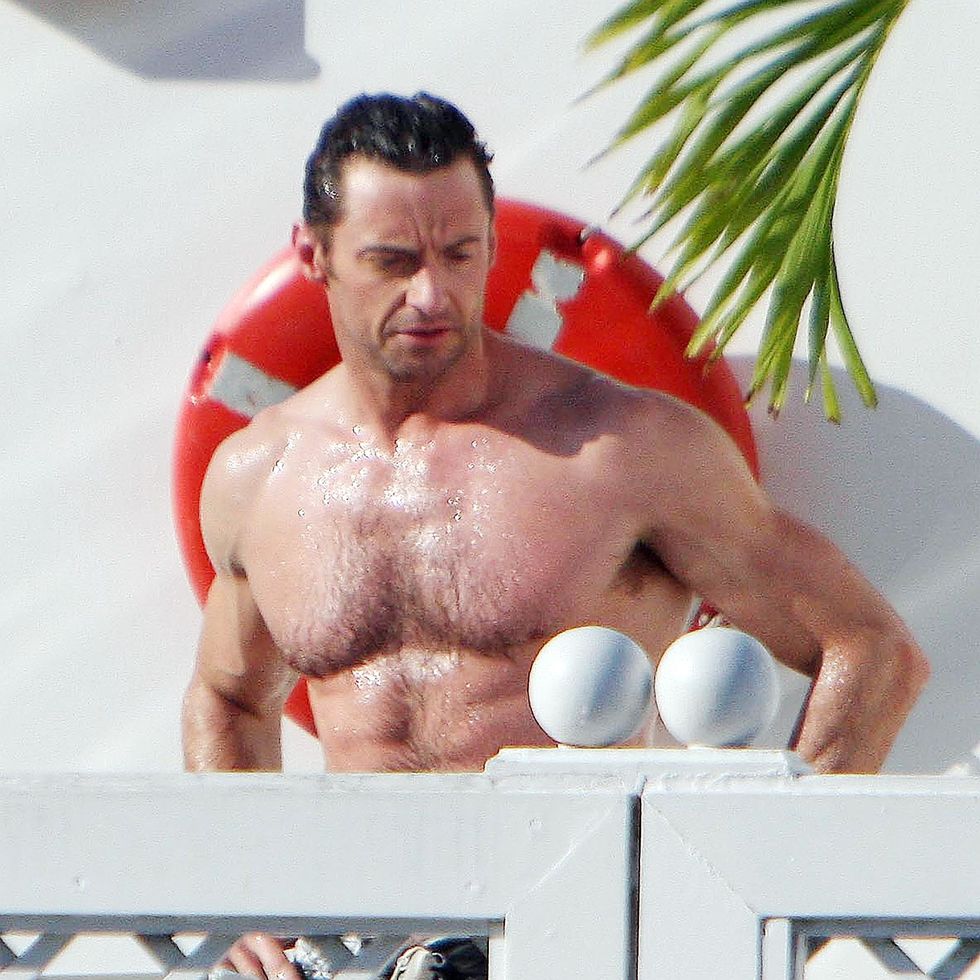 EXC HUGH JACKMAN ENJOYING A DAY AT THE POOL AT HIS HOTEL IN BRAZIL