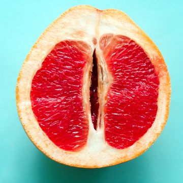 ripe juicy grapefruit  isolated on a blue background