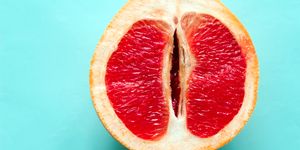 ripe juicy grapefruit  isolated on a blue background