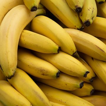 ripe yellow bananas at the shopping market fruits that are good for health the concept of vegetarianism, veganism and raw food vegetarian, vegan and raw food and diet food background, bright color retail sale of seasonal products