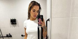 rita ora takes a mirror selfie wearing a white t shirt and white knickers