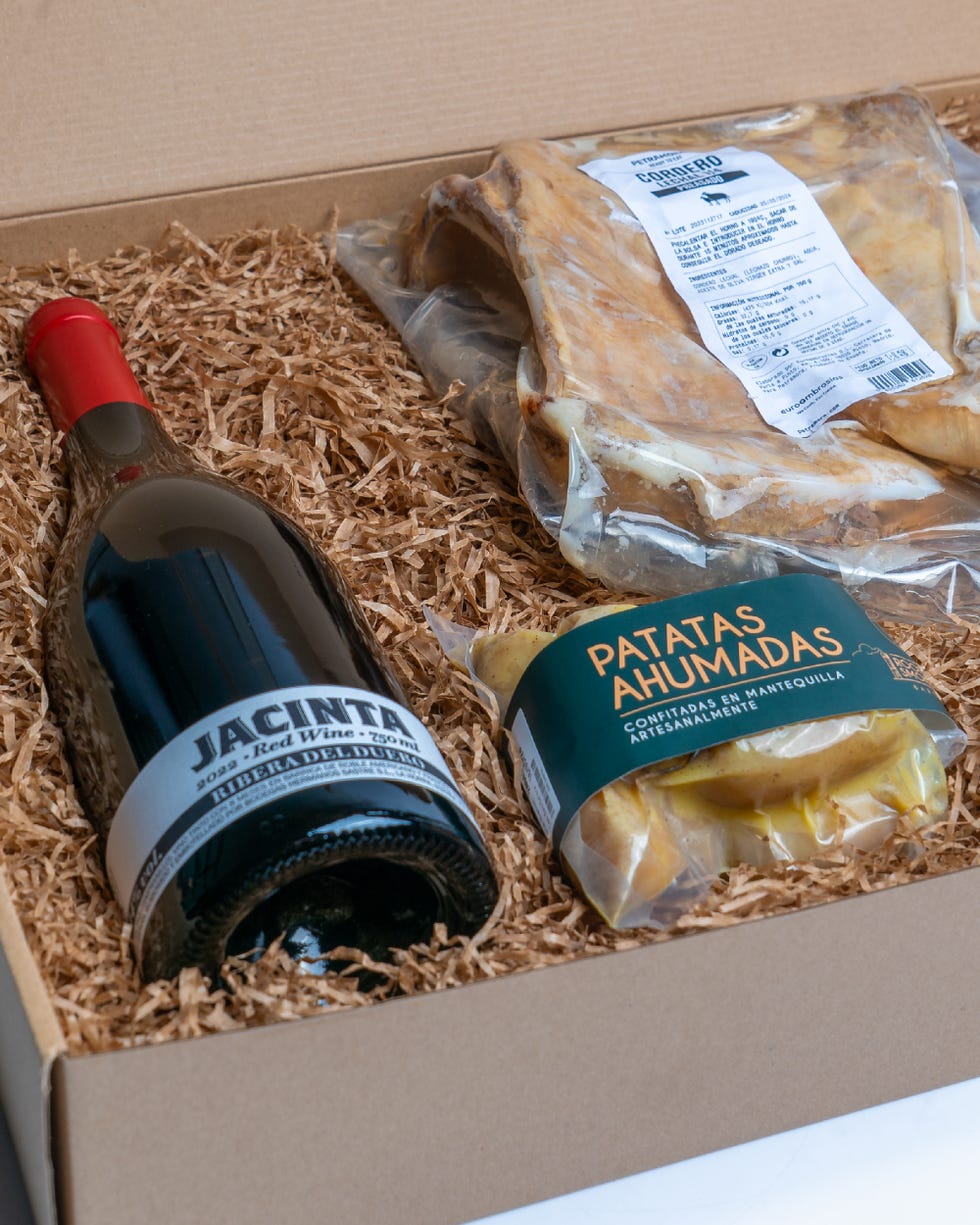 a box of food and a bottle of wine