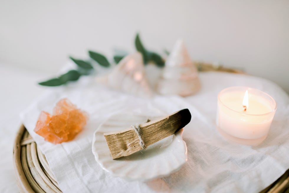 ritual objects for spiritual practice palo santo, candle and crystal