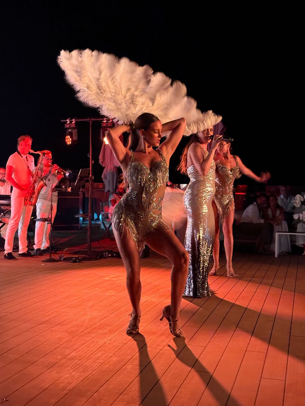 live performance featuring dancers and musicians at a nighttime event
