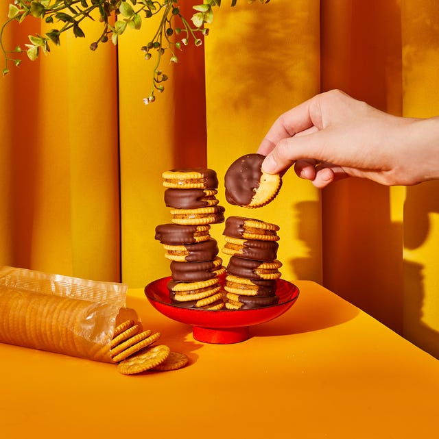 Nut Butter Ritz Sandwiches nut butter ritz sandwiches dipped in chocolate stacked on top of each other