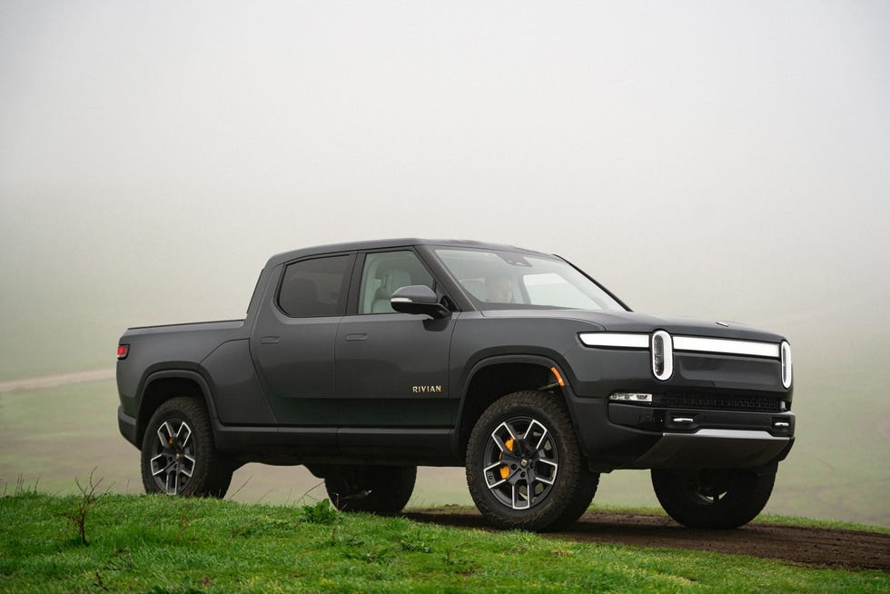 a black truck parked on grass