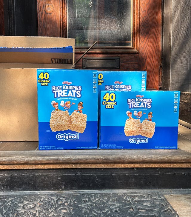 boxes of rice krispies treats on a doorstep