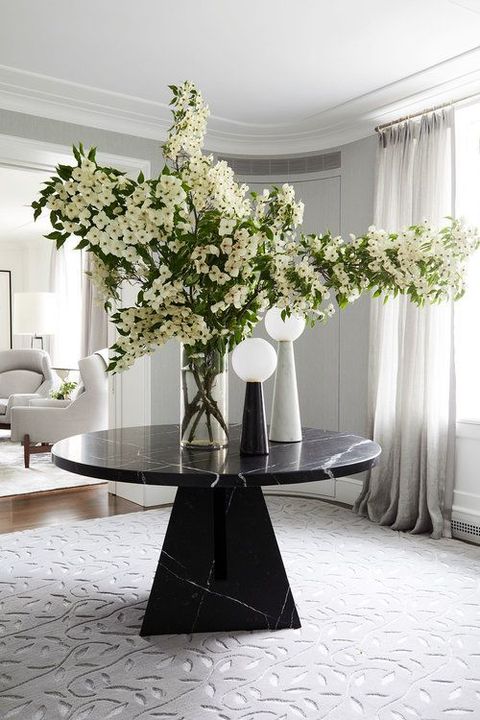 White, Interior design, Room, Vase, Floor, Table, Flower, Bouquet, Furniture, Plant, 