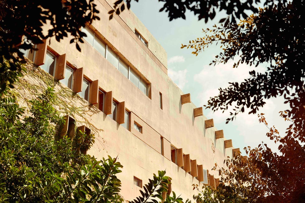the exterior of a sand coloured building