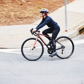 cycling tips a person riding a bicycle on a road around a corner