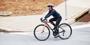 cycling tips a person riding a bicycle on a road around a corner