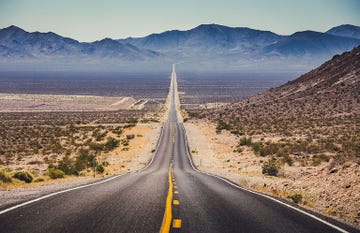 Road, Highway, Sky, Mountainous landforms, Asphalt, Mountain, Lane, Thoroughfare, Road surface, Natural landscape, 