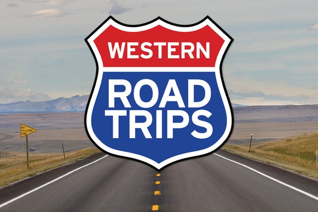sign indicating western road trips along an open road