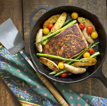roast salmon and vegetables in a cast iron pan