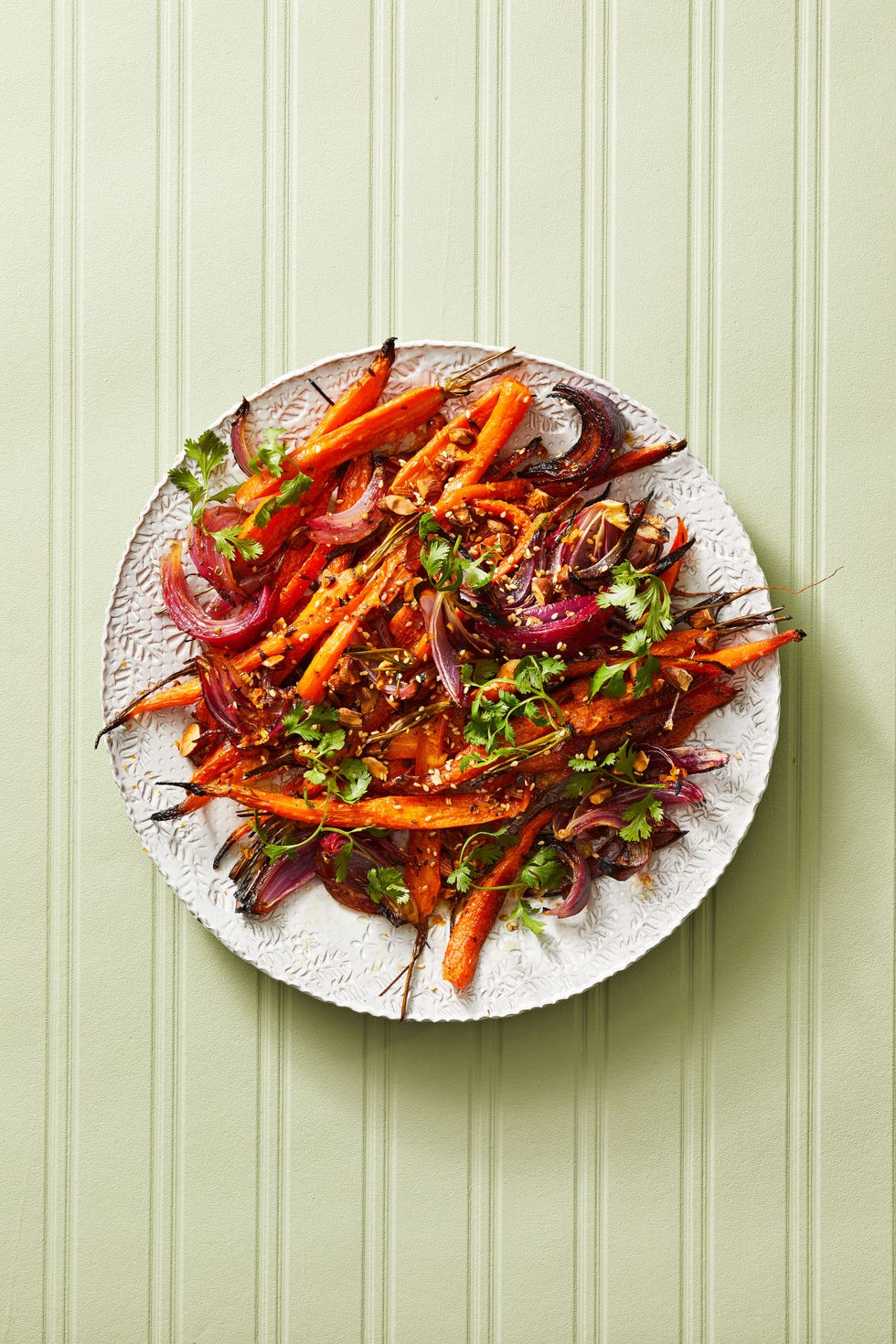 roasted carrots and red onions on a plate