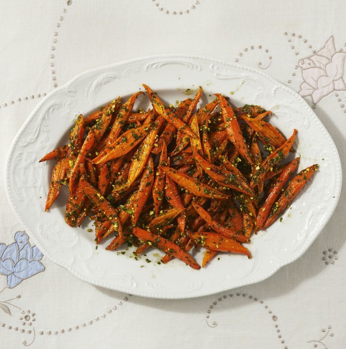 roasted carrots with spring pesto on white platter